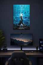 Aquaman Movie Poster in a gaming desk setup above a monitor.