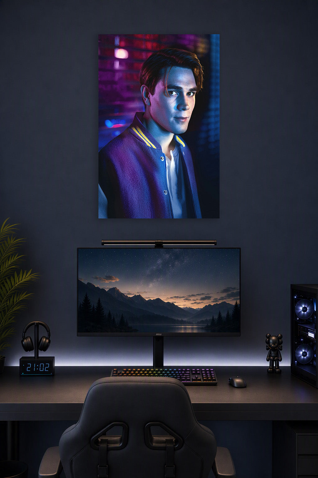 Archie Andrews Riverdale in a gaming desk setup above a monitor.