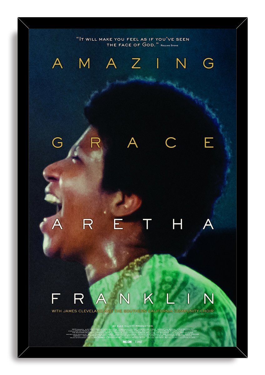 Aretha Franklin Amazing Grace framed wall art print features a profile performance portrait in green robes within a black frame.