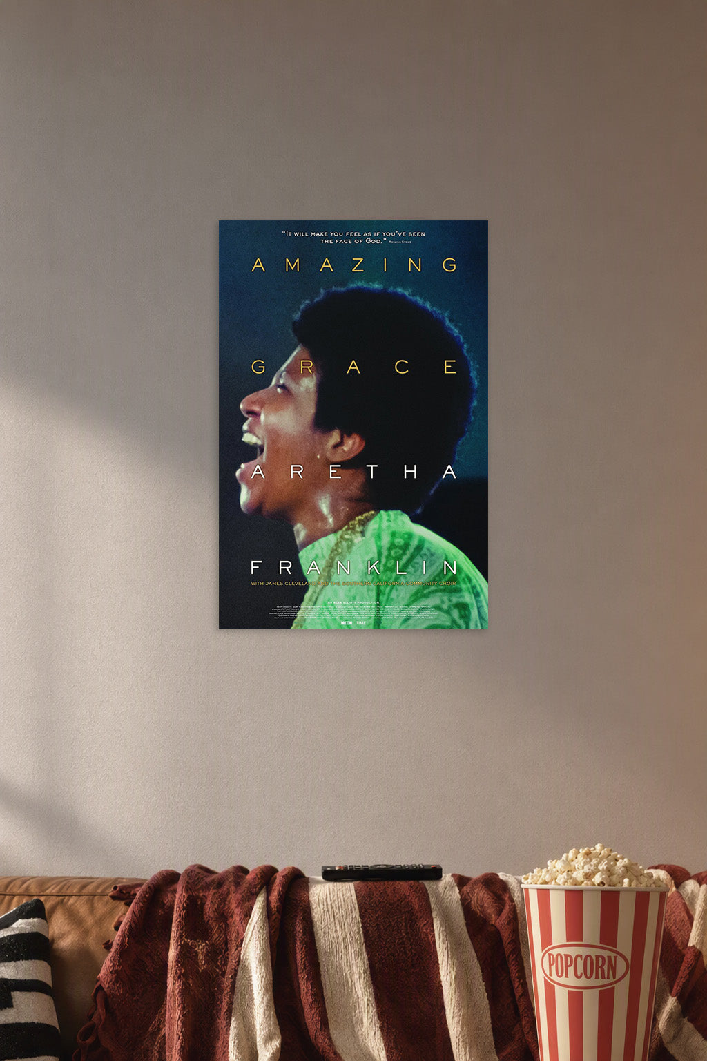 Aretha Franklin Amazing Grace in a cozy movie room above a brown sofa with popcorn.