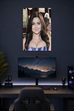 Ariel Winter in a gaming desk setup above a monitor.