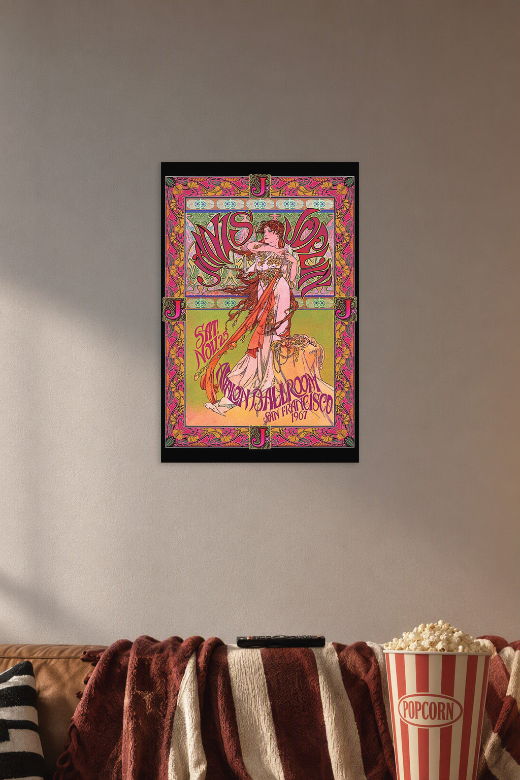 Art Nouveau Woman Psychedelic Concert Poster in a cozy movie room above a brown sofa with popcorn.