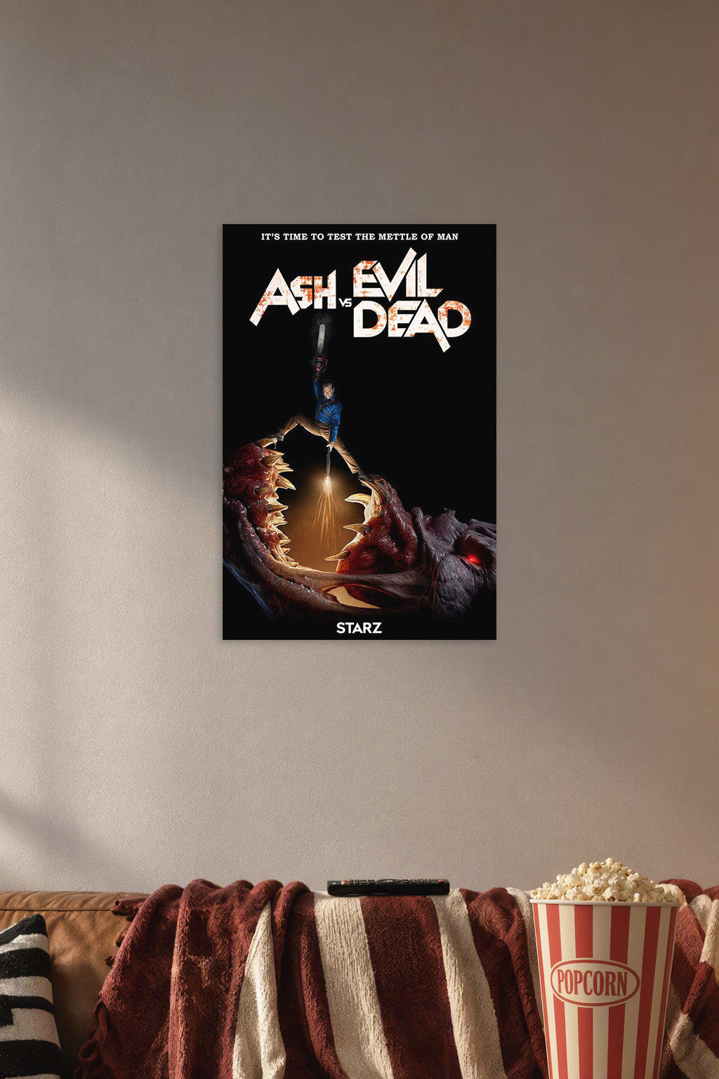 Ash vs Evil Dead Ash Williams in a cozy movie room above a brown sofa with popcorn.