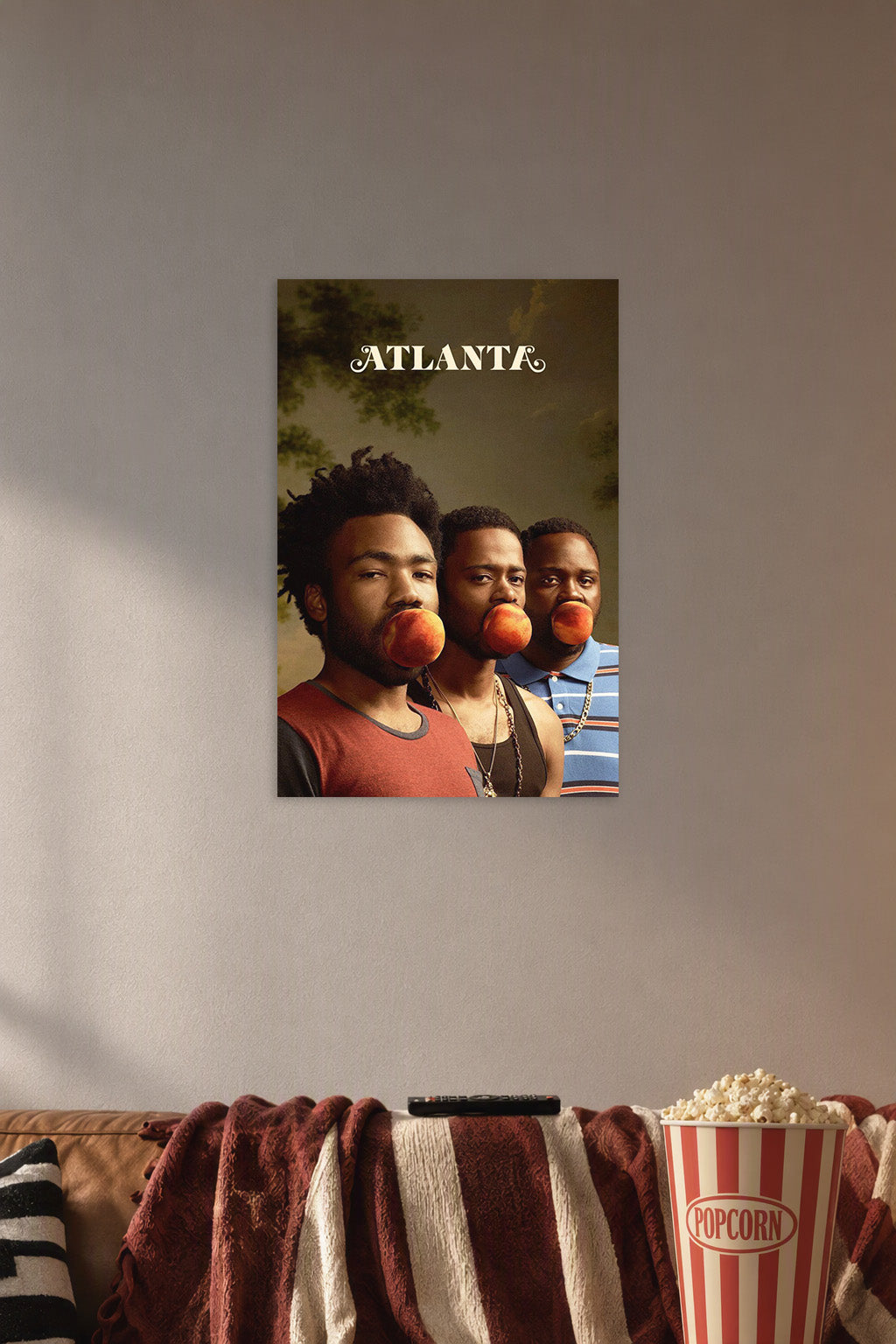 Atlanta TV Series Cast in a cozy movie room above a brown sofa with popcorn.
