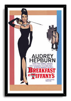 Breakfast at Tiffany's framed wall art print featuring Audrey Hepburn in black dress, with cat, city couple, and bold red title.