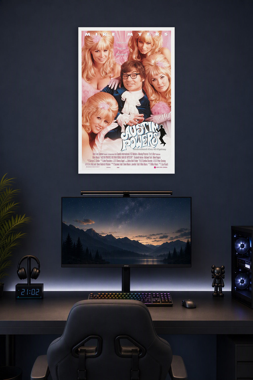 Austin Powers International Man of Mystery in a gaming desk setup above a monitor.