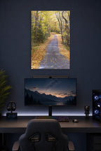 Autumn Forest Path in a gaming desk setup above a monitor.