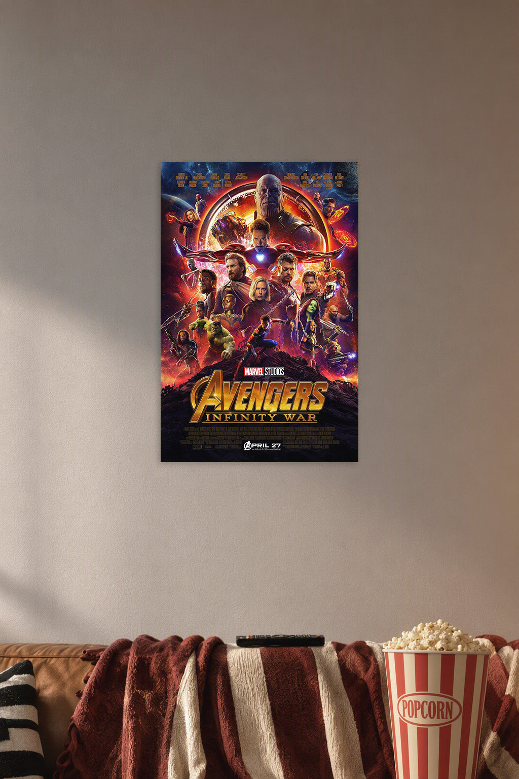 Avengers: Infinity War in a cozy movie room above a brown sofa with popcorn.