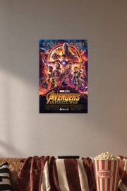Avengers Infinity War Movie Poster in a cozy movie room above a brown sofa with popcorn.