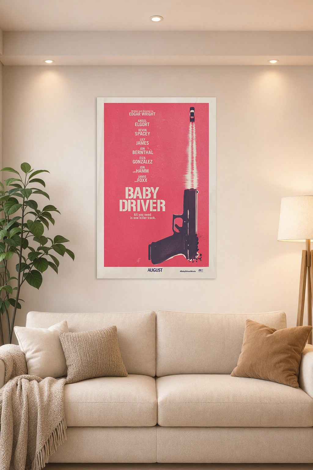Baby Driver Movie in a bright living room above a beige sofa.