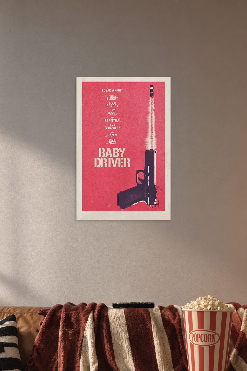 Baby Driver Movie in a cozy movie room above a brown sofa with popcorn.