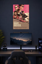 Baby Driver Movie Poster in a gaming desk setup above a monitor.