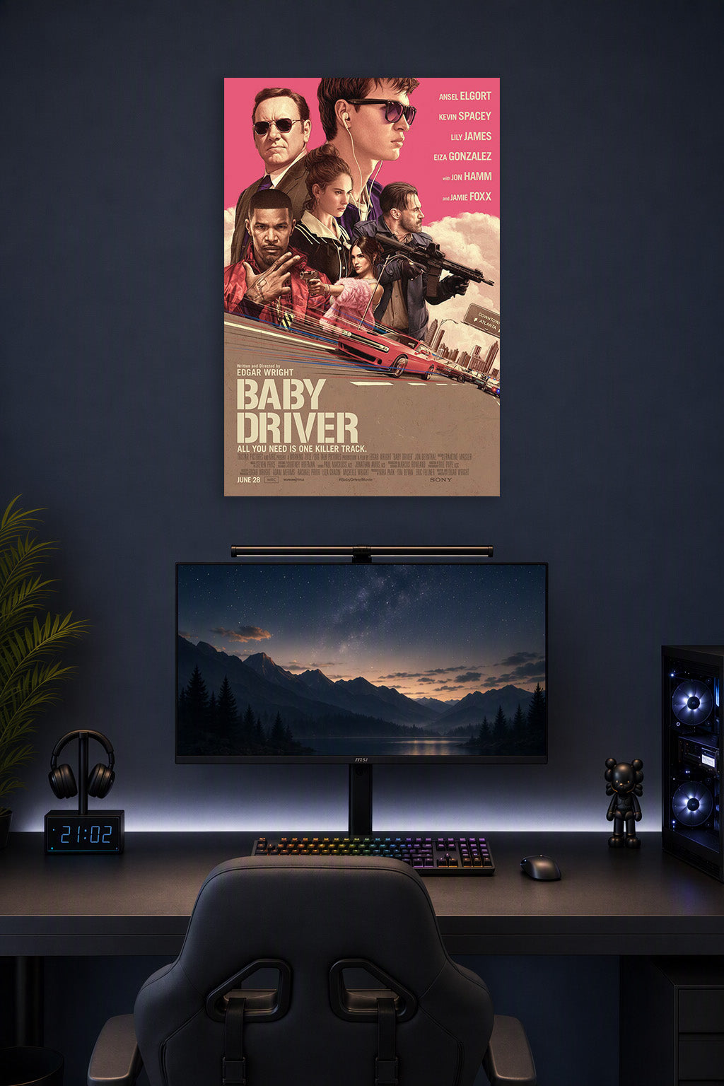 Baby Driver Movie Poster in a gaming desk setup above a monitor.