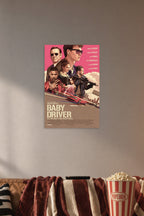 Baby Driver Movie Poster in a cozy movie room above a brown sofa with popcorn.