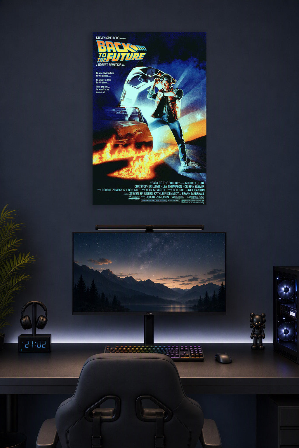Back to the Future Movie Poster in a gaming desk setup above a monitor.