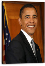 Barack Obama canvas wall art print displaying a smiling portrait in a dark suit, with a U.S. flag and wood-paneled backdrop.