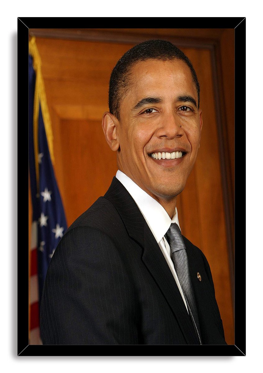 Barack Obama framed wall art print featuring his smiling formal portrait in a black frame, beside a U.S. flag.