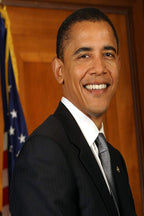 Barack Obama poster portrait with a smiling Obama in a dark pinstripe suit before a warm wood wall and U.S. flag.