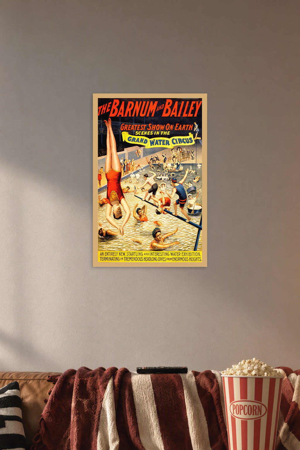 Barnum & Bailey Grand Water Circus in a cozy movie room above a brown sofa with popcorn.