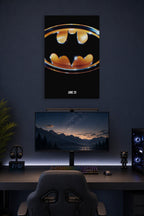 Batman Logo in a gaming desk setup above a monitor.