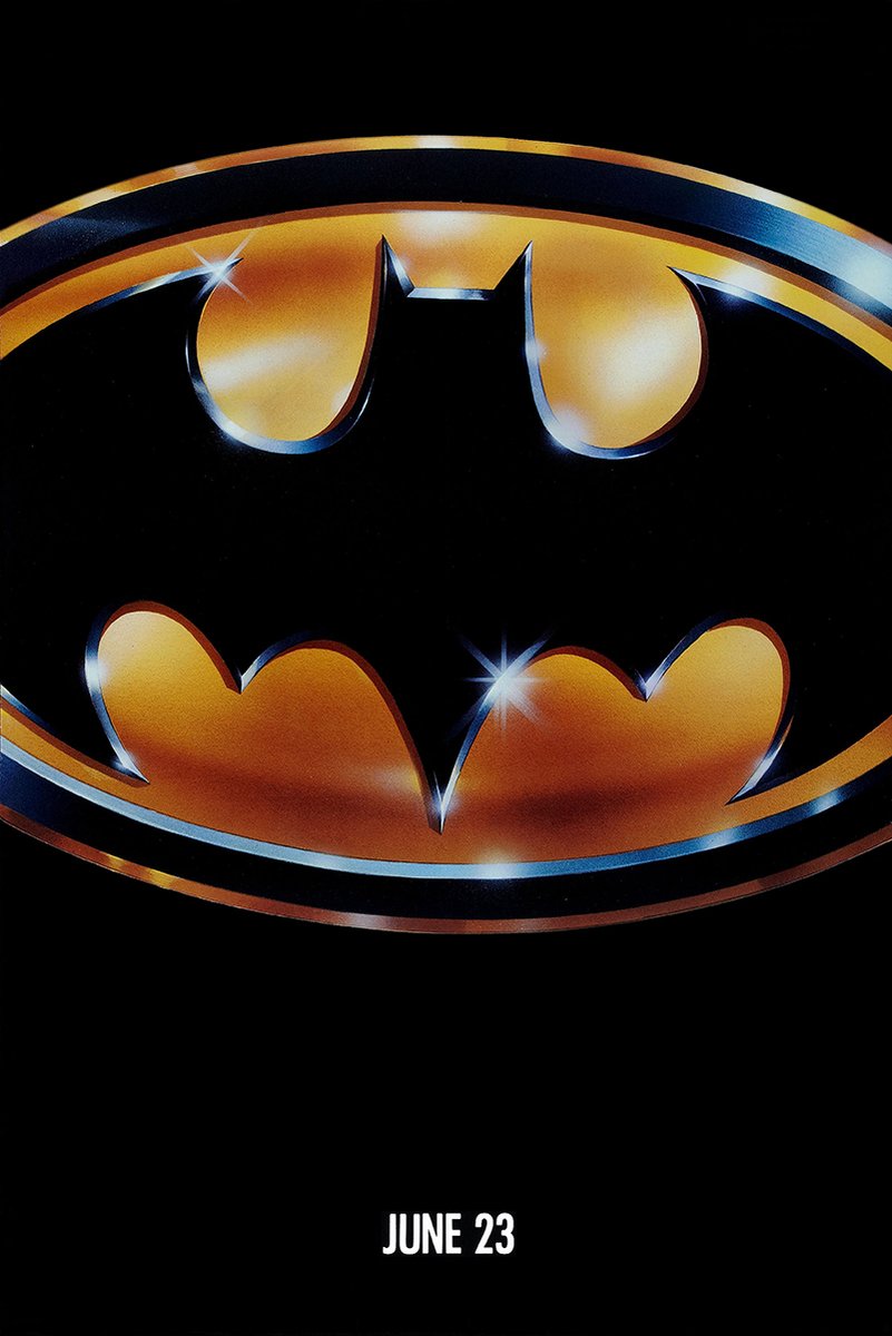 Batman poster with a glossy black bat silhouette inside a metallic gold oval emblem and white “JUNE 23” text.