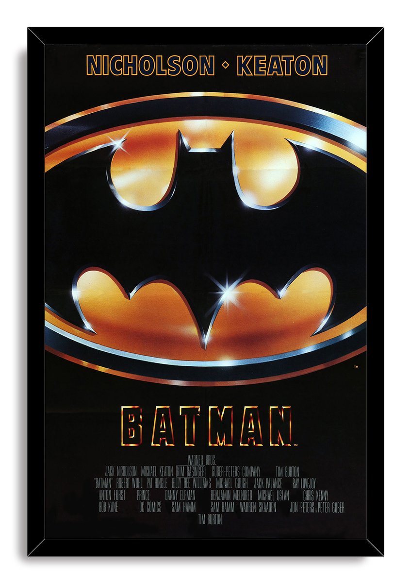 Batman framed wall art print presents the black-and-gold bat emblem, bright highlights, cast names, and title in a black frame.