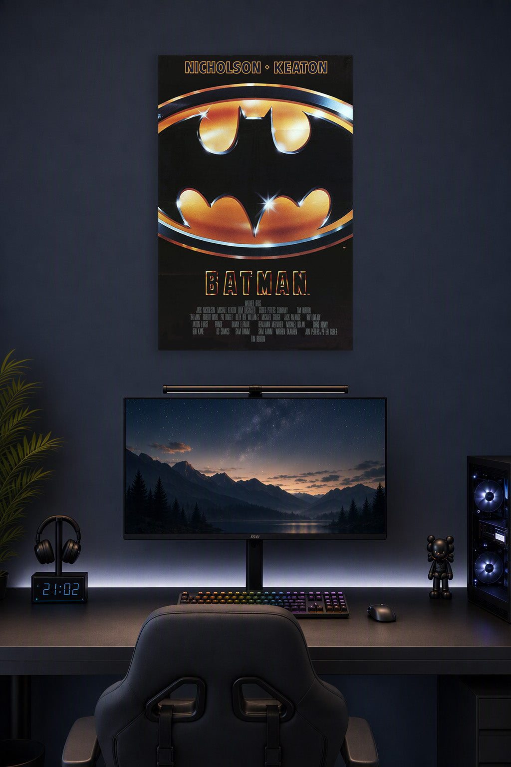Batman Movie in a gaming desk setup above a monitor.
