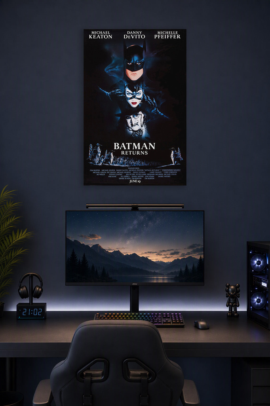 Batman Returns Movie Poster in a gaming desk setup above a monitor.
