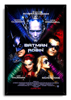 Batman & Robin framed wall art print featuring Batman, Robin, Mr. Freeze, Poison Ivy, and Batgirl against colorful light beams.