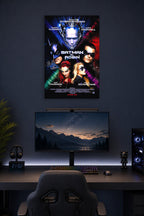 Batman & Robin Movie Poster in a gaming desk setup above a monitor.