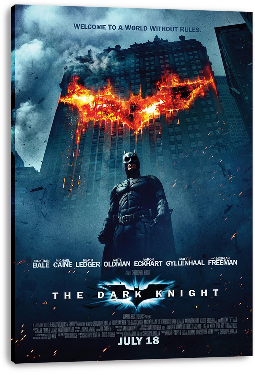 Batman The Dark Knight canvas wall art print presents Batman beneath a blazing bat symbol on a tall city building.