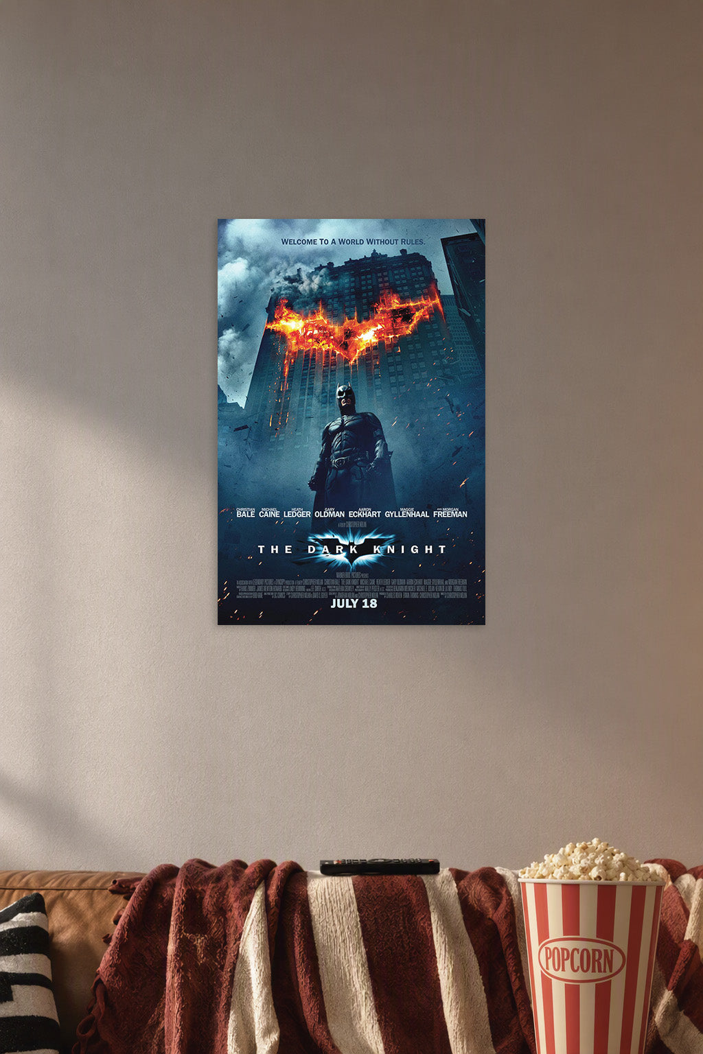 Batman The Dark Knight in a cozy movie room above a brown sofa with popcorn.