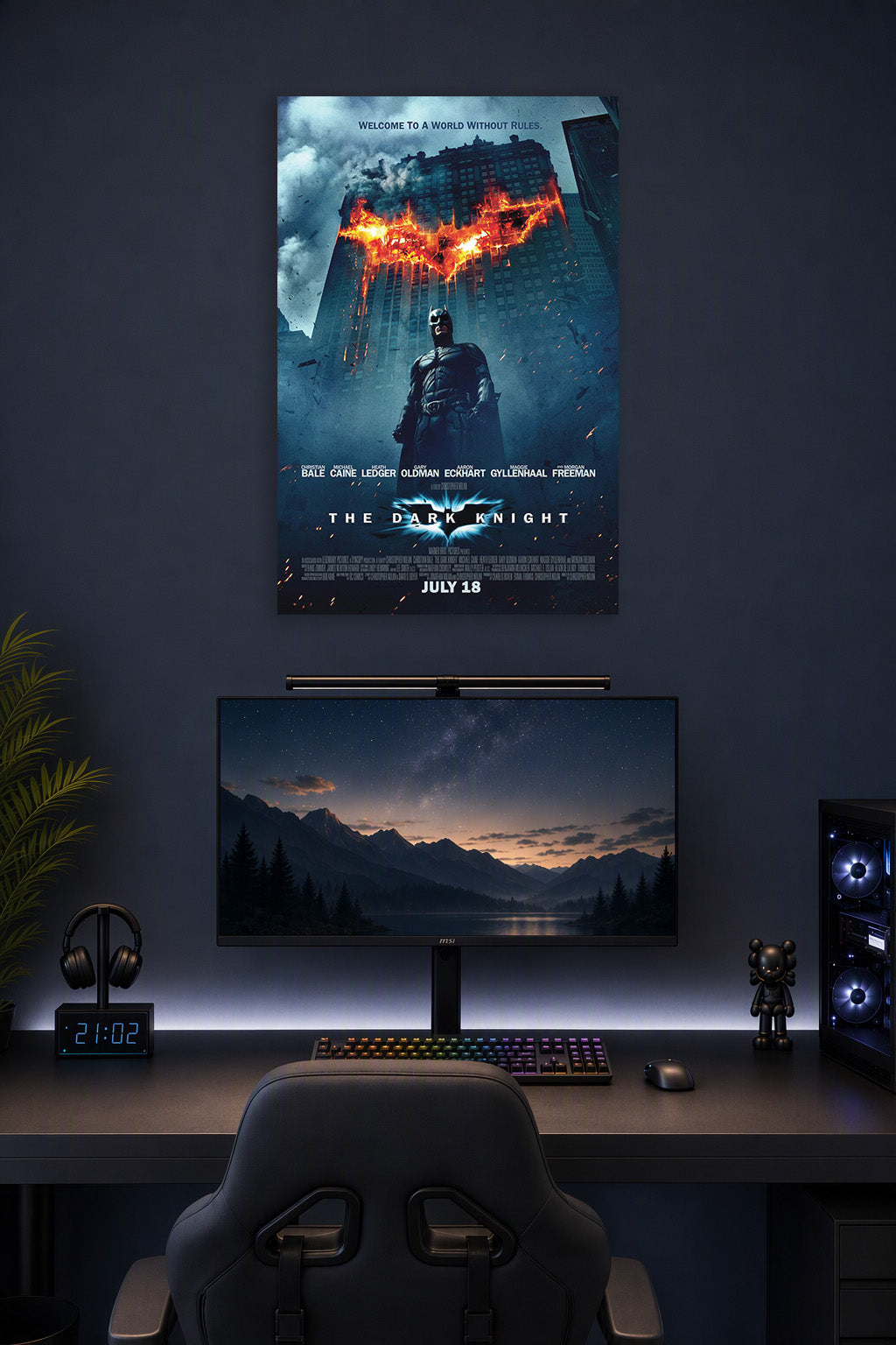 Batman The Dark Knight in a gaming desk setup above a monitor.
