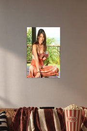 Beautiful Woman Portrait in a cozy movie room above a brown sofa with popcorn.