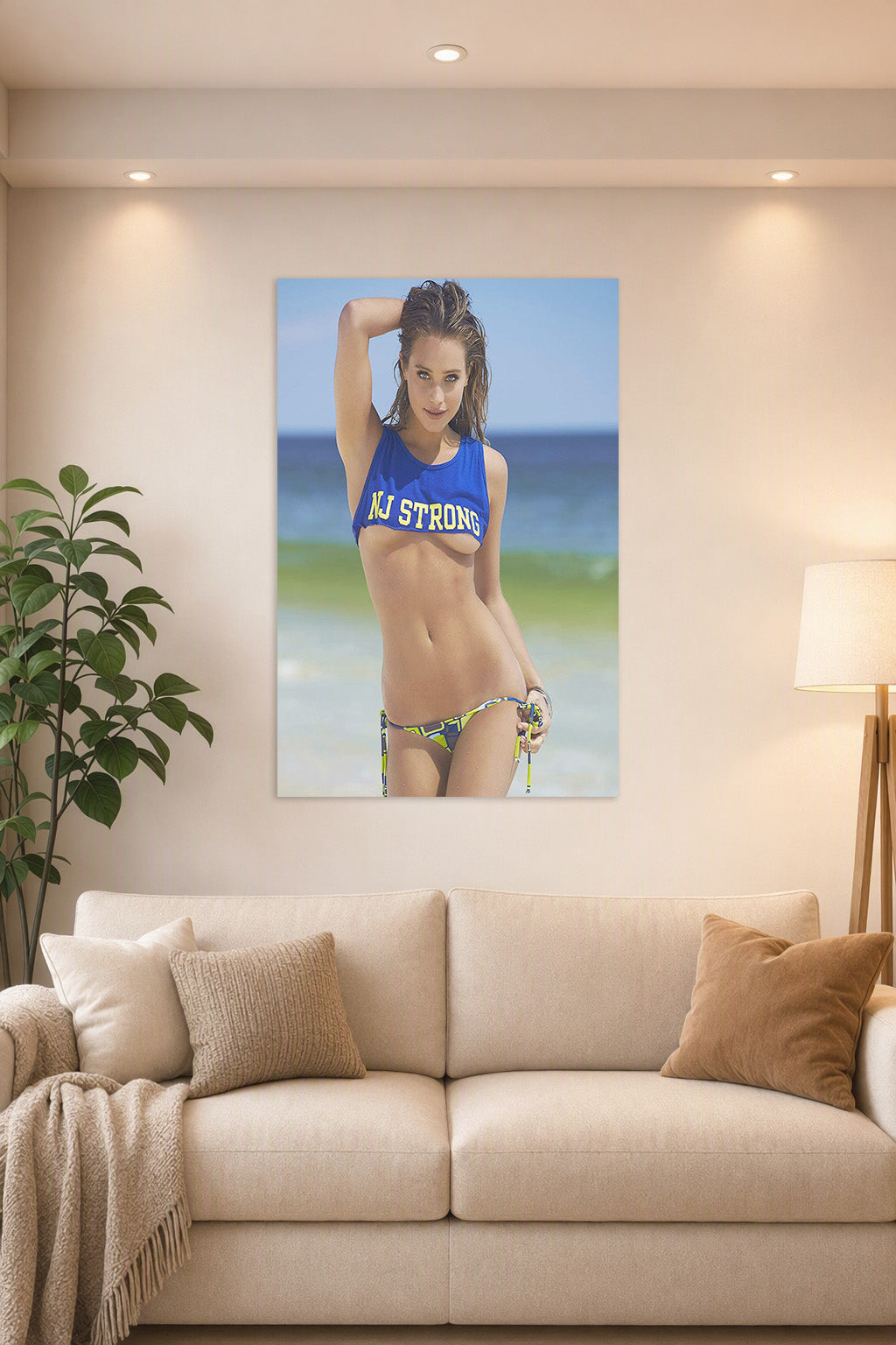 Beautiful Woman on Beach in a bright living room above a beige sofa.