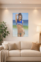 Beautiful Woman on Beach in a bright living room above a beige sofa.