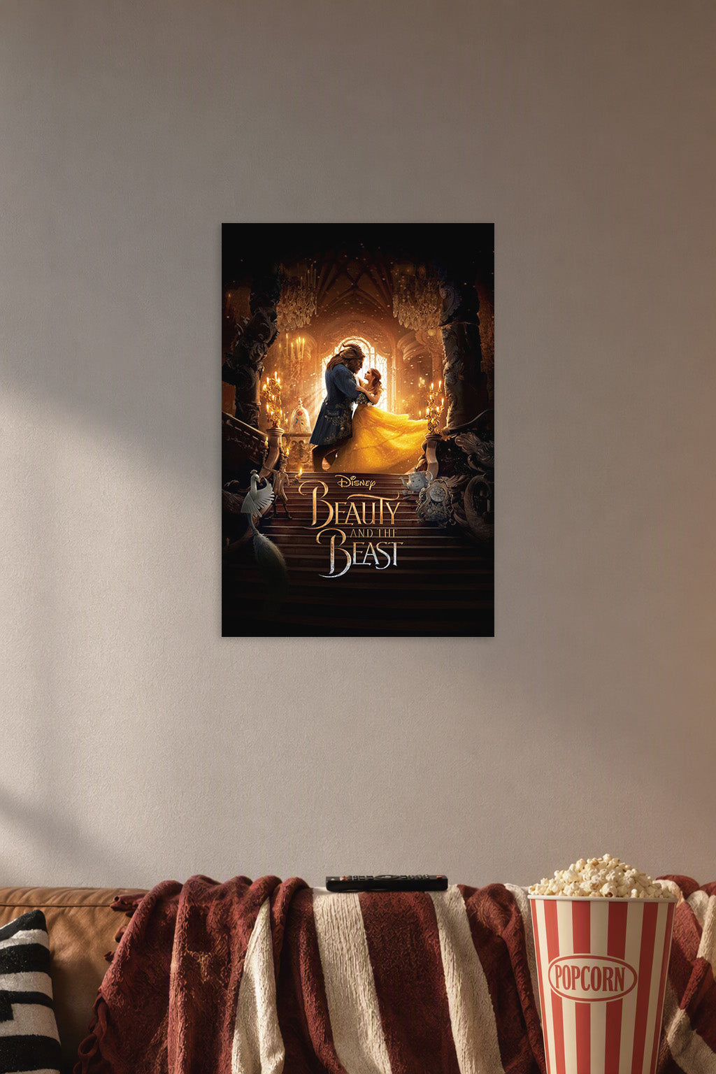 Beauty and the Beast Movie in a cozy movie room above a brown sofa with popcorn.