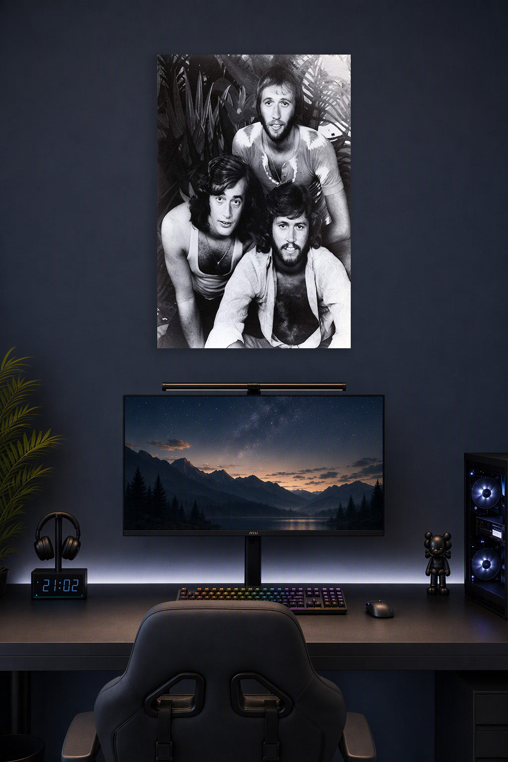 Bee Gees in a gaming desk setup above a monitor.