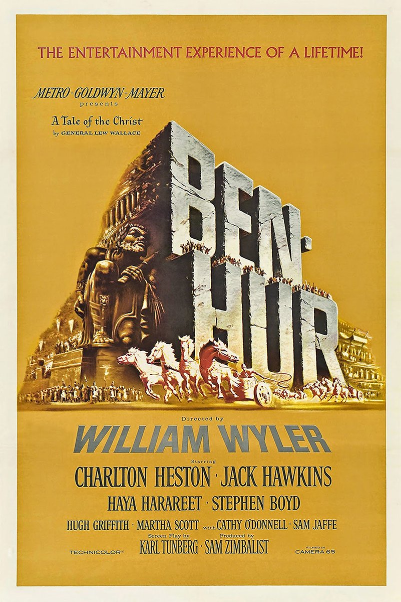 Ben-Hur movie poster print in golden yellow, with monumental title letters, a Roman statue, and a chariot race.