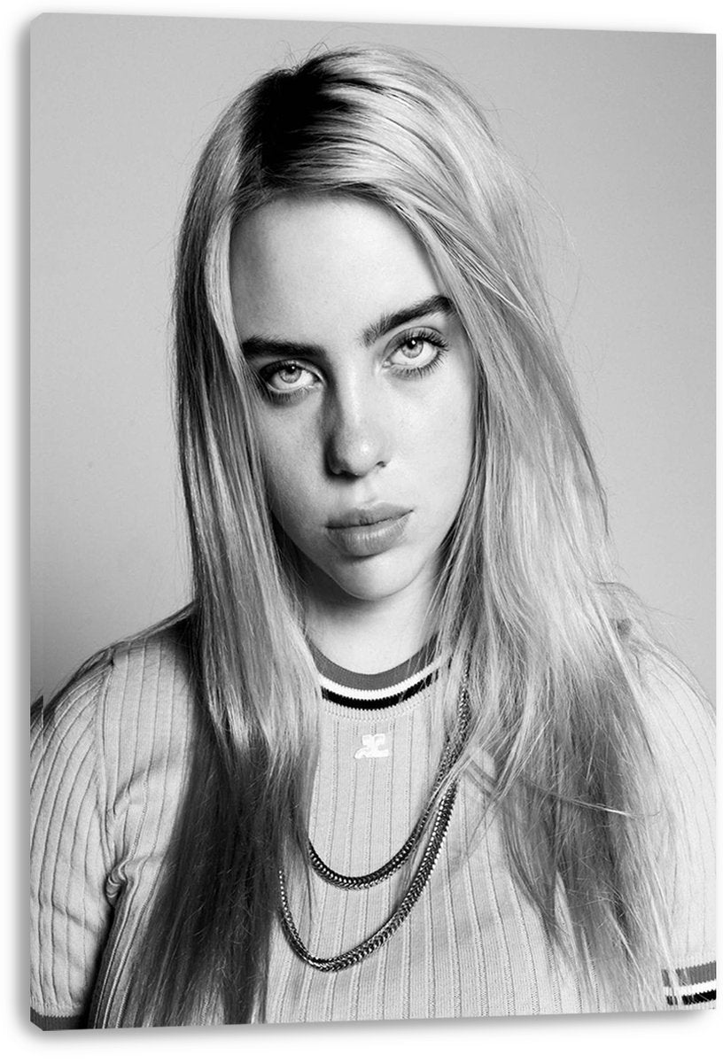Billie Eilish canvas wall art print displays a monochrome portrait of the singer with long hair, direct gaze, and layered necklaces.