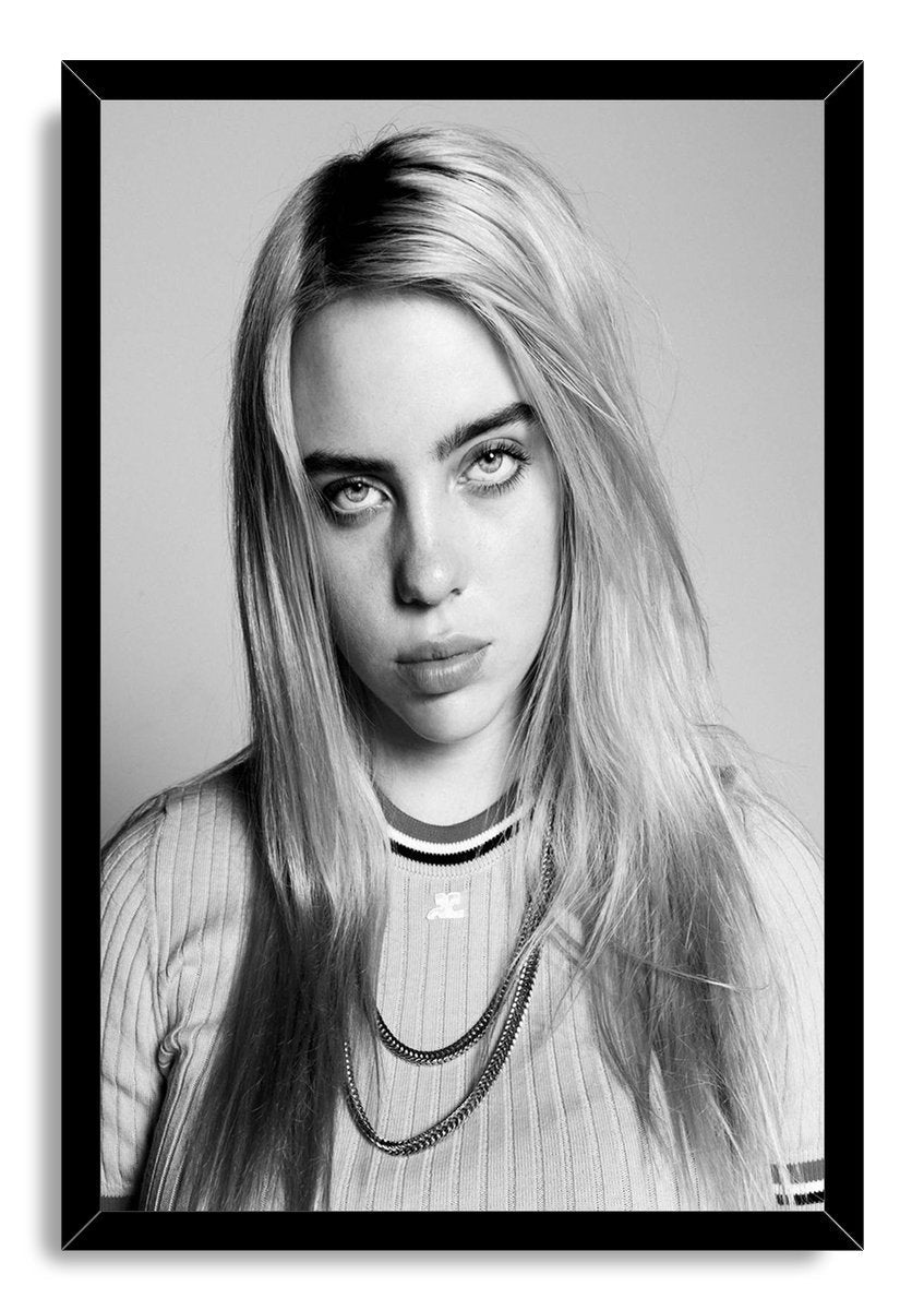 Billie Eilish framed wall art print presents a black-and-white portrait with long loose hair, striped shirt, and necklaces in a black frame.