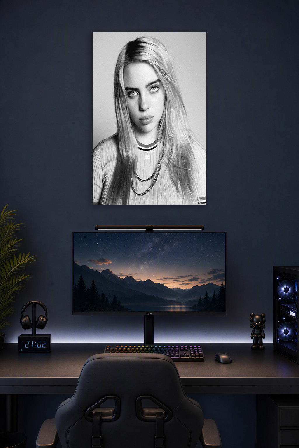 Billie Eilish in a gaming desk setup above a monitor.