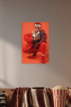 Billie Eilish in a cozy movie room above a brown sofa with popcorn.