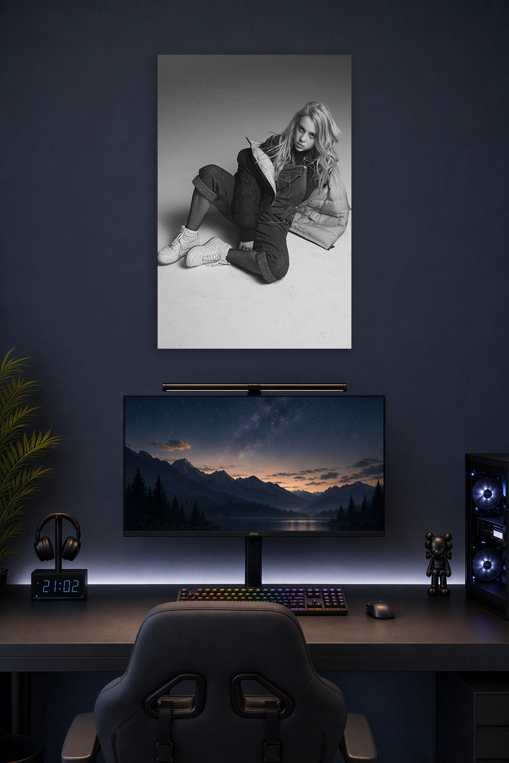 Billie Eilish in a gaming desk setup above a monitor.