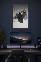 Billie Eilish in a gaming desk setup above a monitor.