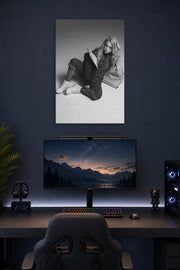 Billie Eilish in a gaming desk setup above a monitor.