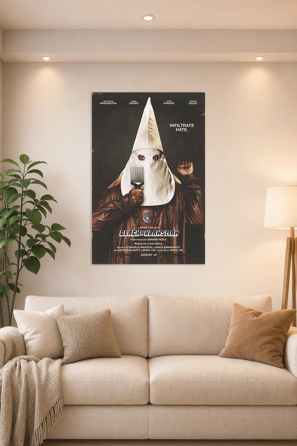 BlacKkKlansman Movie Poster in a bright living room above a beige sofa.