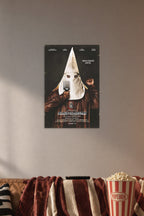 BlacKkKlansman Movie Poster in a cozy movie room above a brown sofa with popcorn.