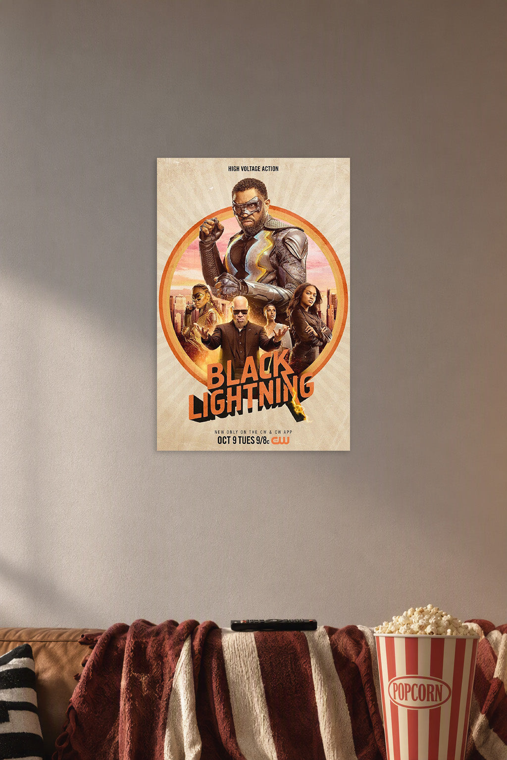 Black Lightning TV Series in a cozy movie room above a brown sofa with popcorn.