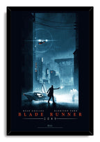 Blade Runner 2049 framed wall art print features an armed figure and sleek car in a dark, rain-drenched futuristic city.